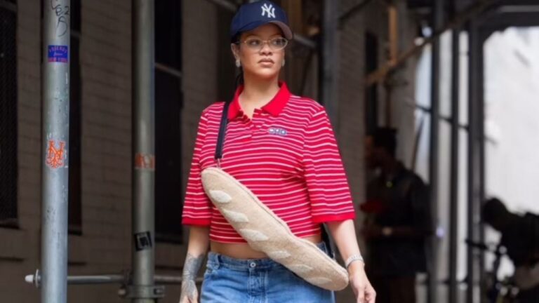 You Ask We Answer Rihanna Stepped Out in New York in a Red and White Martine Rose Polo Blue Jeans and a 1350 Fendi Baguette shaped Bag feat image